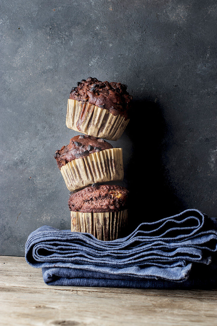 Yummy muffin made with chocolate and banana on blue towel