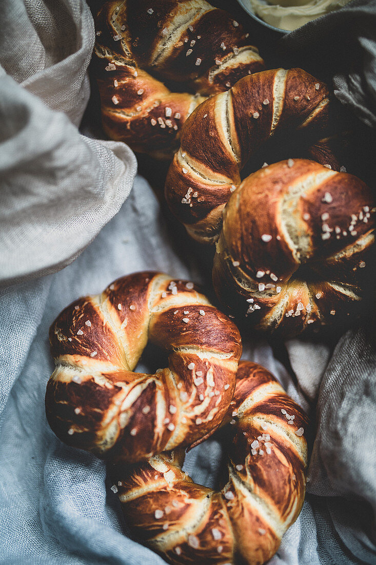 Pretzel rings with sea salt on a linen cloth