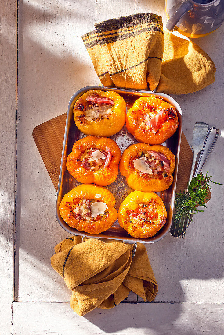 Stuffed yellow peppers with pancetta and vegetables
