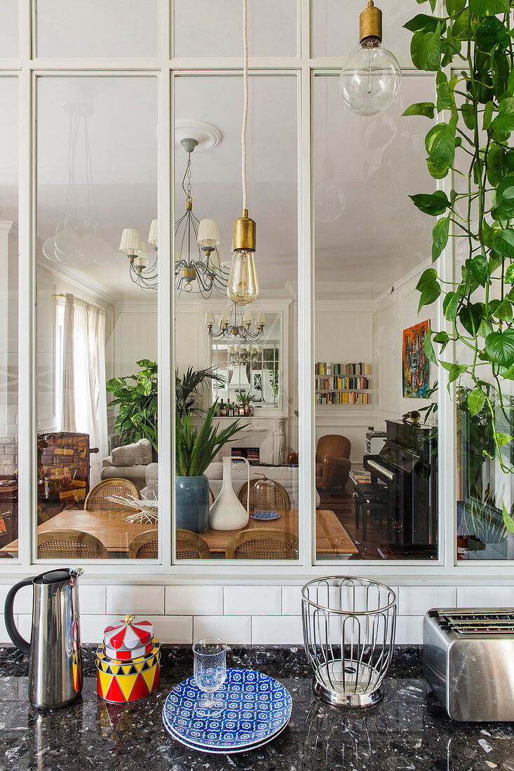 View from kitchen into living area through interior window