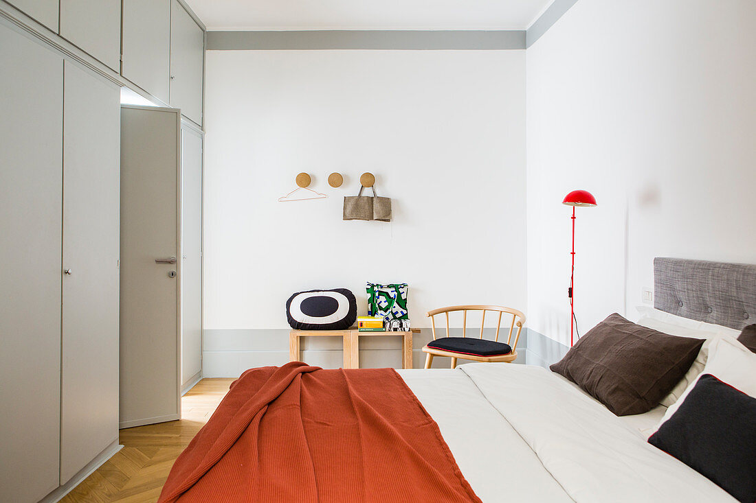 Floor-to-ceiling grey fitted wardrobes in bedroom