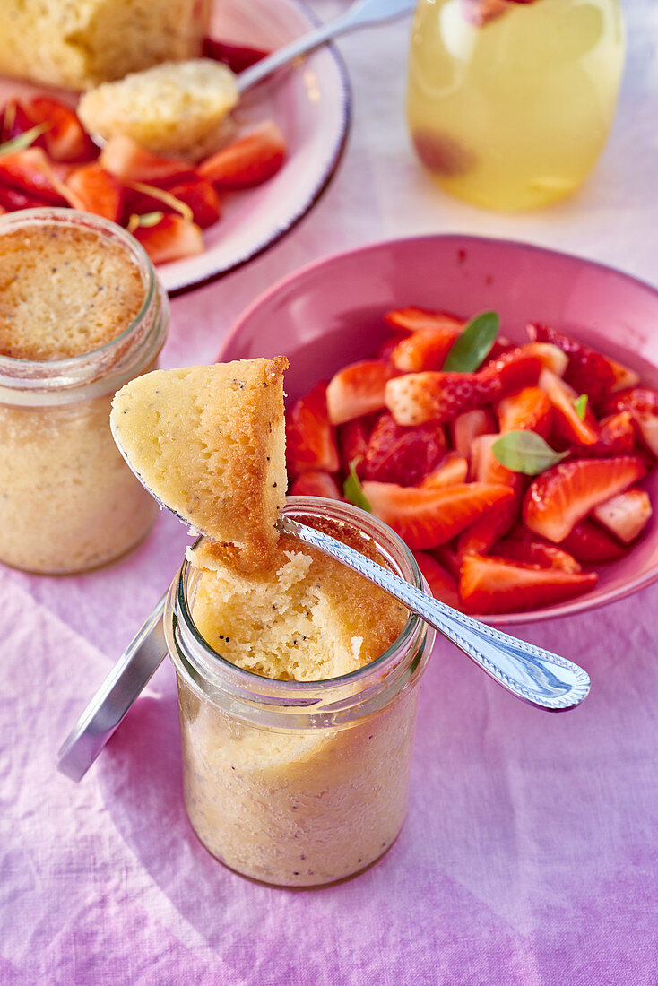 Lemon cake baked in glasses and strawberry salad