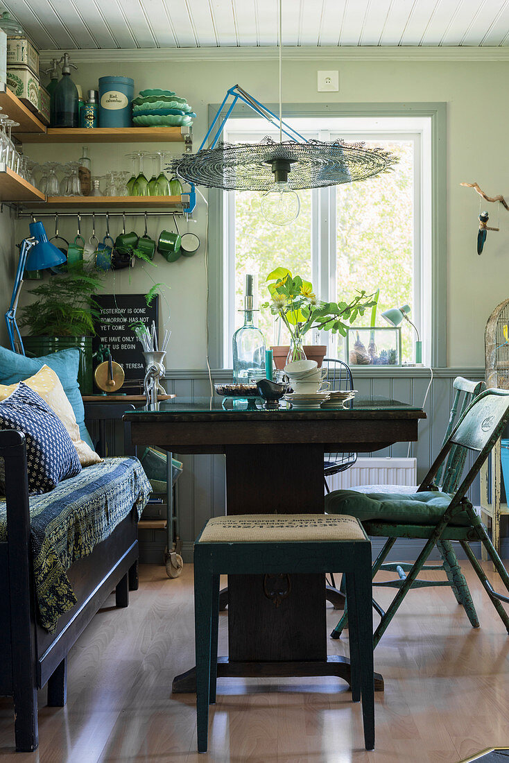 Dining table, wooden bench and various vintage chairs and stools