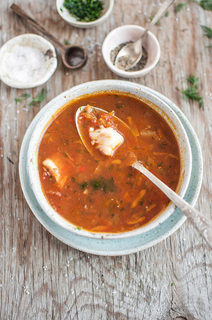 Fish soup with cod, tomatoes and fresh dill
