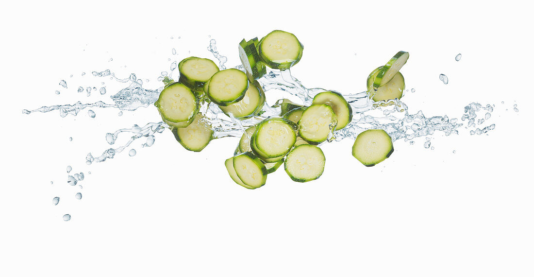 Courgette slices with a splash of water