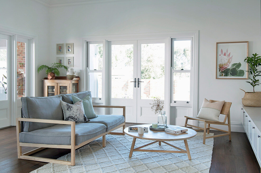 Light wood sofa and armchair in the living room in Scandinavian style