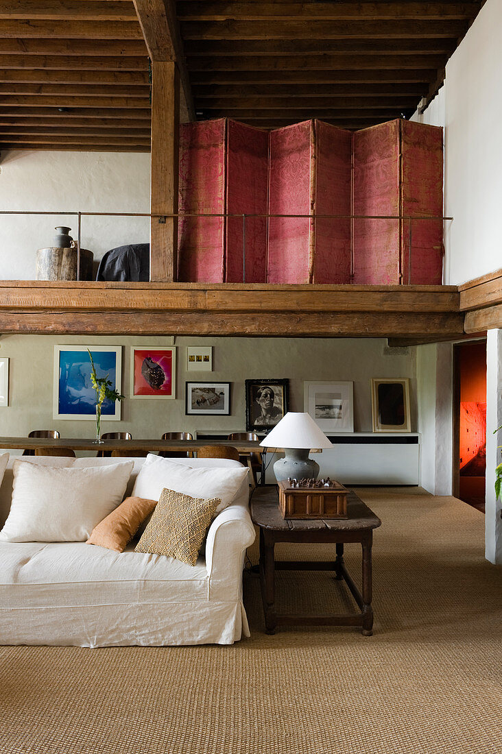 Red folding screen on mezzanine in renovated Antwerp house