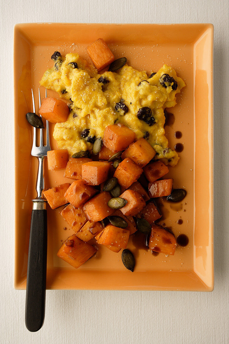 Pumpkin vegetables with omelette, olives and pumpkin seeds