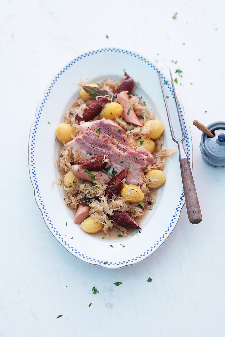 Alsace sauerkraut with apple, potatoes, sausage and bacon