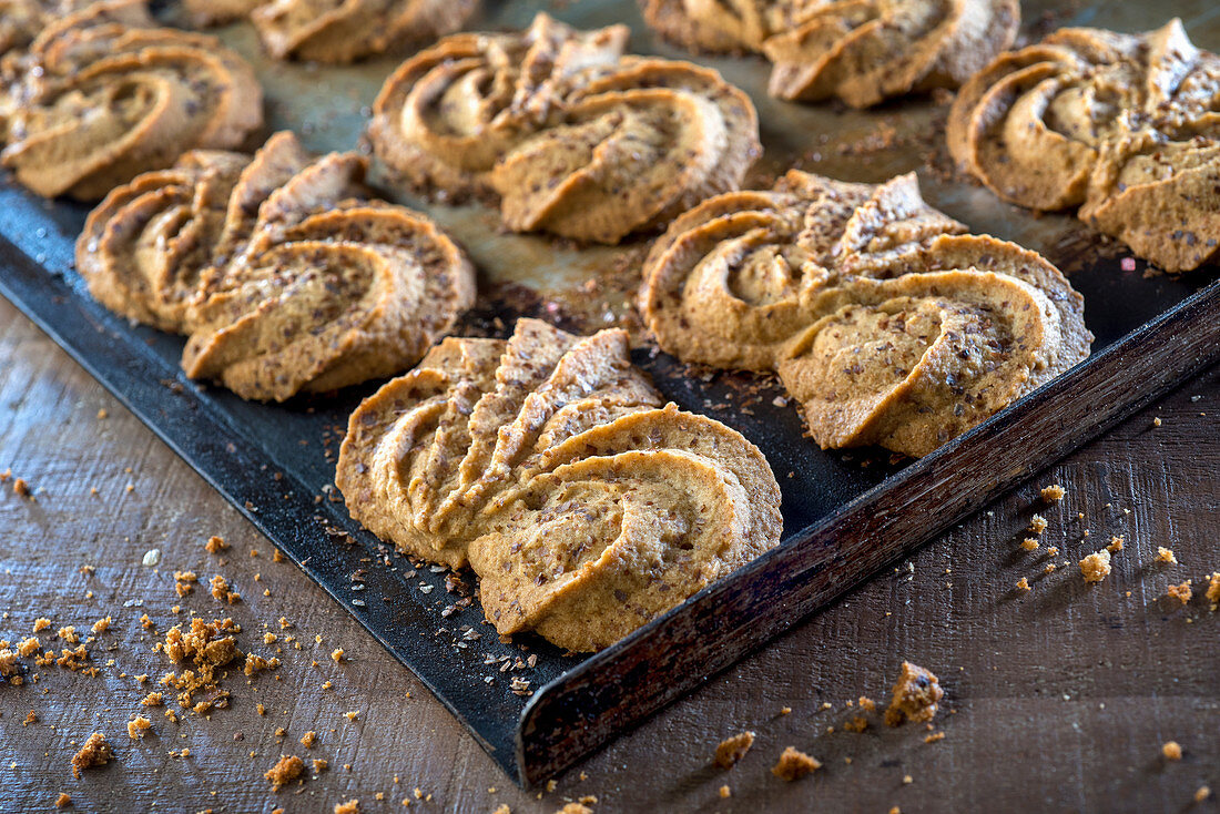 Wholemeal piped biscuits on a baking tray