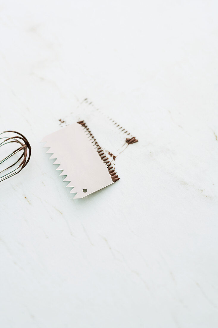 A baking comb and a whisk