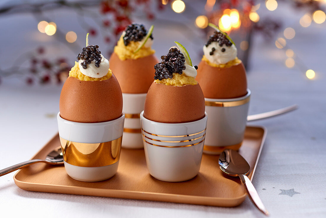 Stuffed eggs with caviar and sour cream