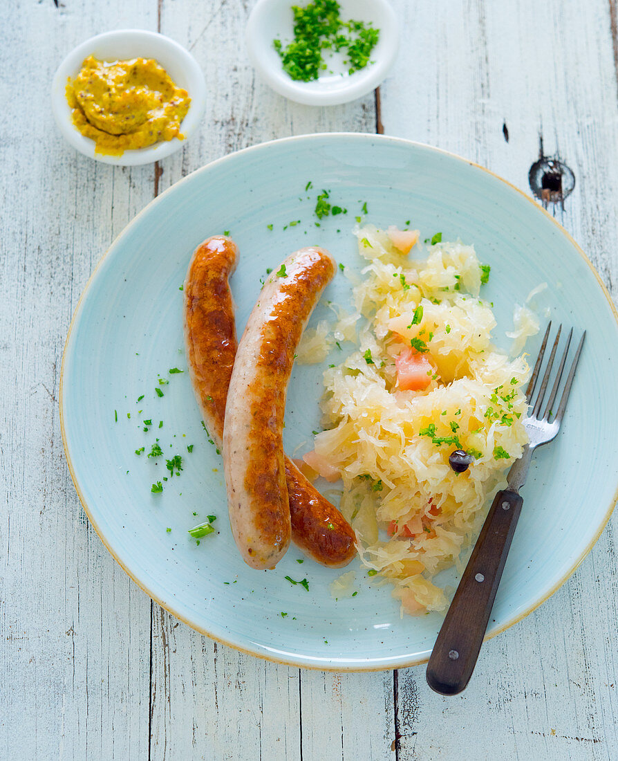 Sausages with apple sauerkraut and mustard
