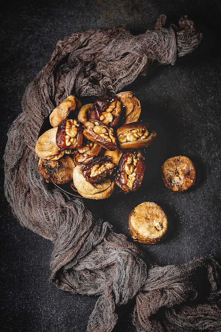 Dates fruits with walnuts and dried figs and cinnamon muslim halal snack for Ramadan