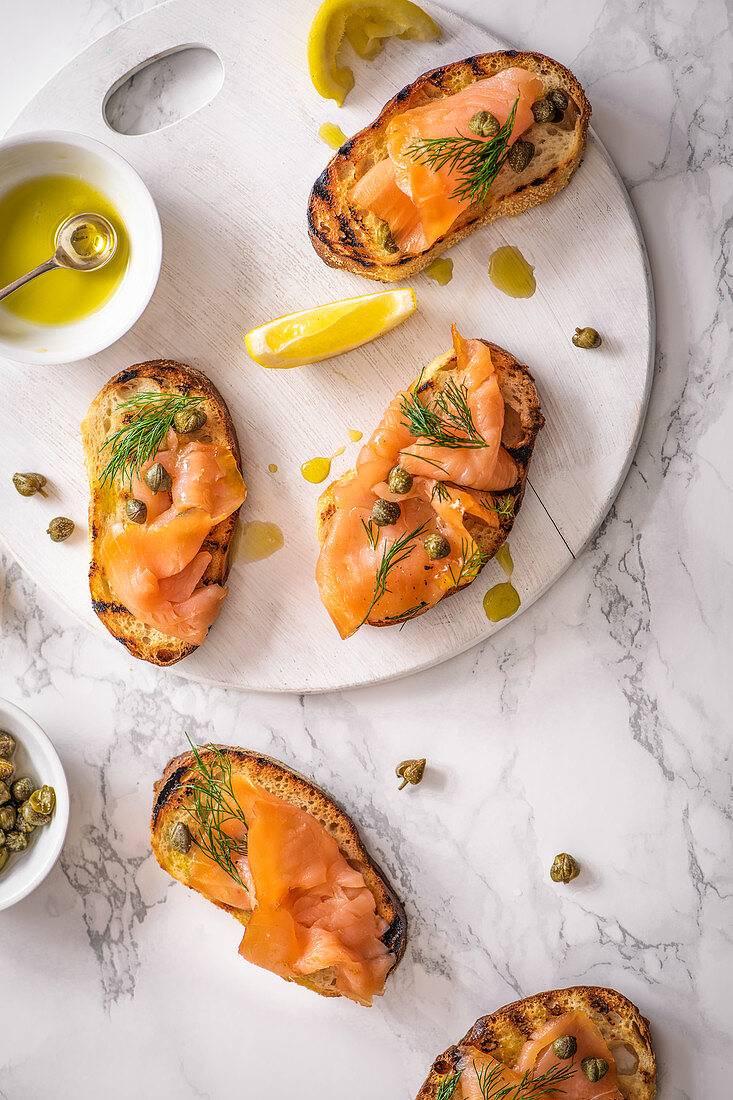 Smoked salmon crostini with capers, dill, olive oil and lemon