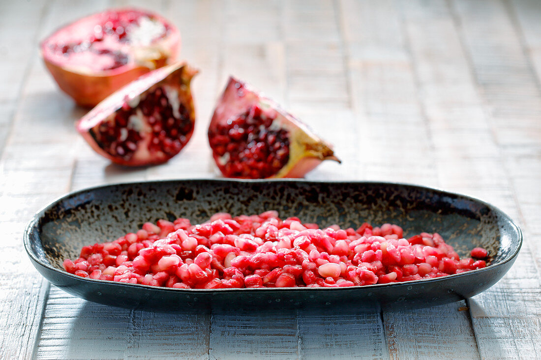 Pomegranate seeds in a dish