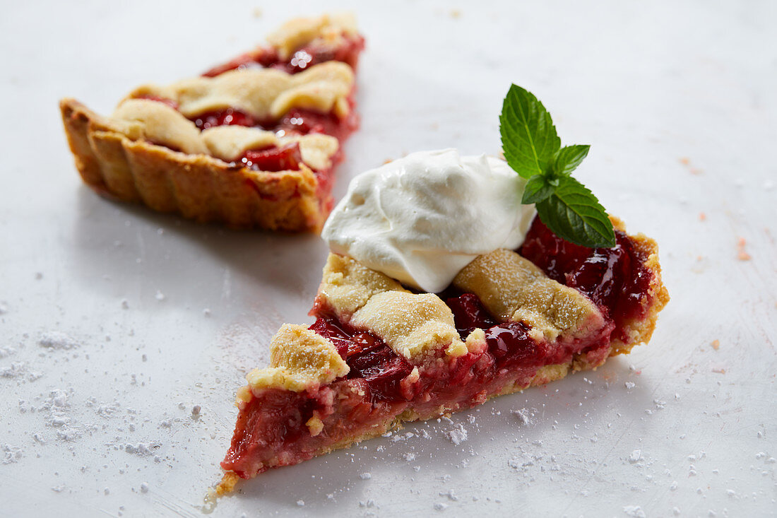 Two slices of strawberry and rhubarb tart