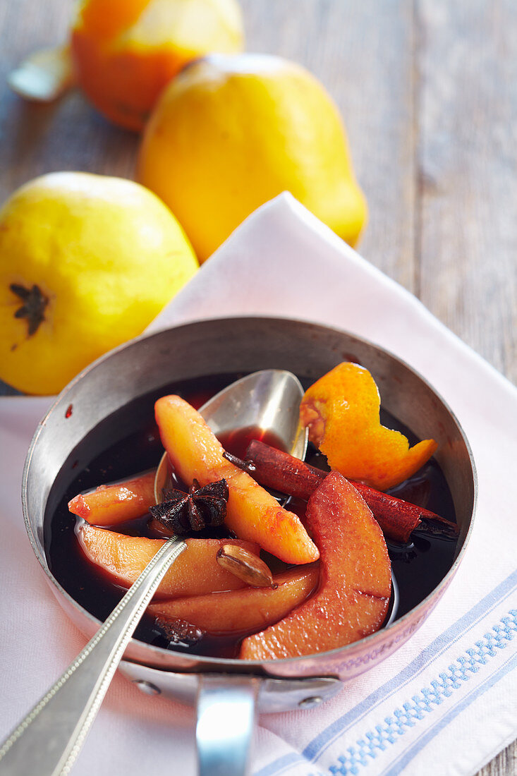 Quinces preserved in spiced red wine with star anise, cardamom, cinnamon and lemon