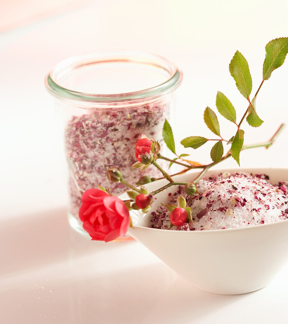A homemade sugar mixture with fresh rose petals