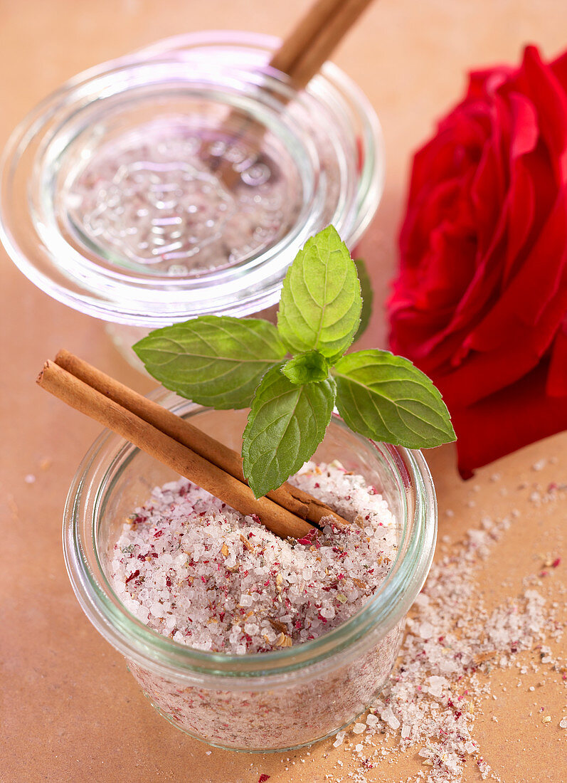 Homemade oriental rose and cinnamon salt with fresh rose petals and mint