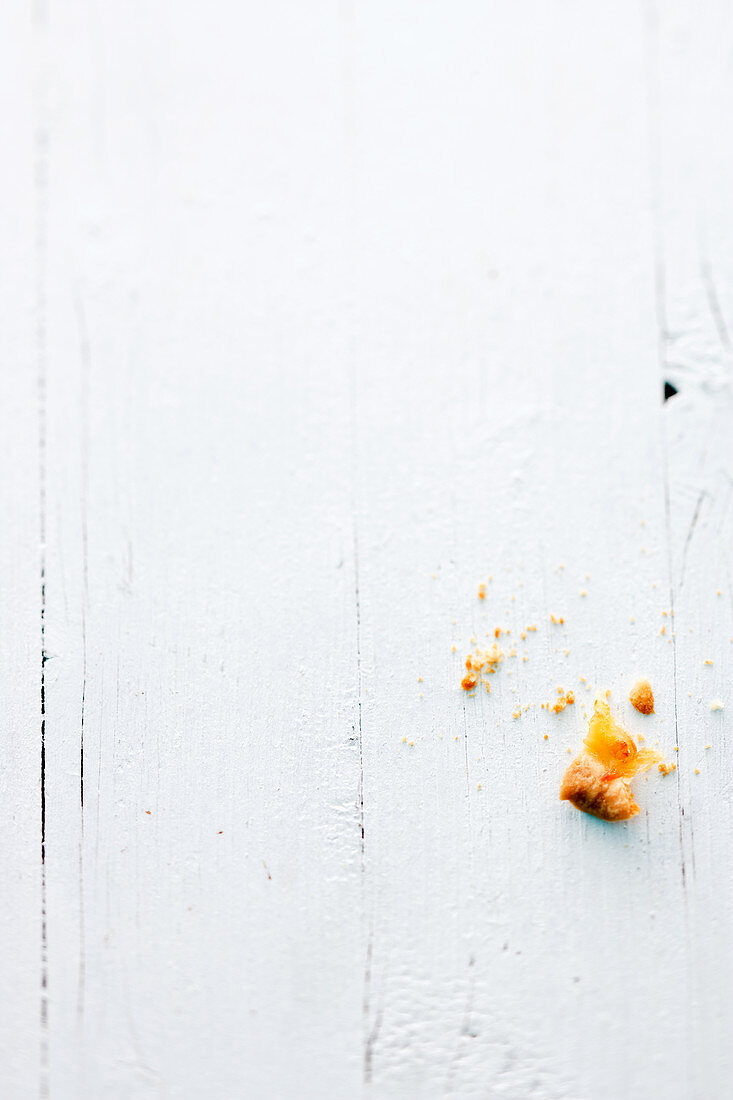 The remains of quiche on a wooden surface