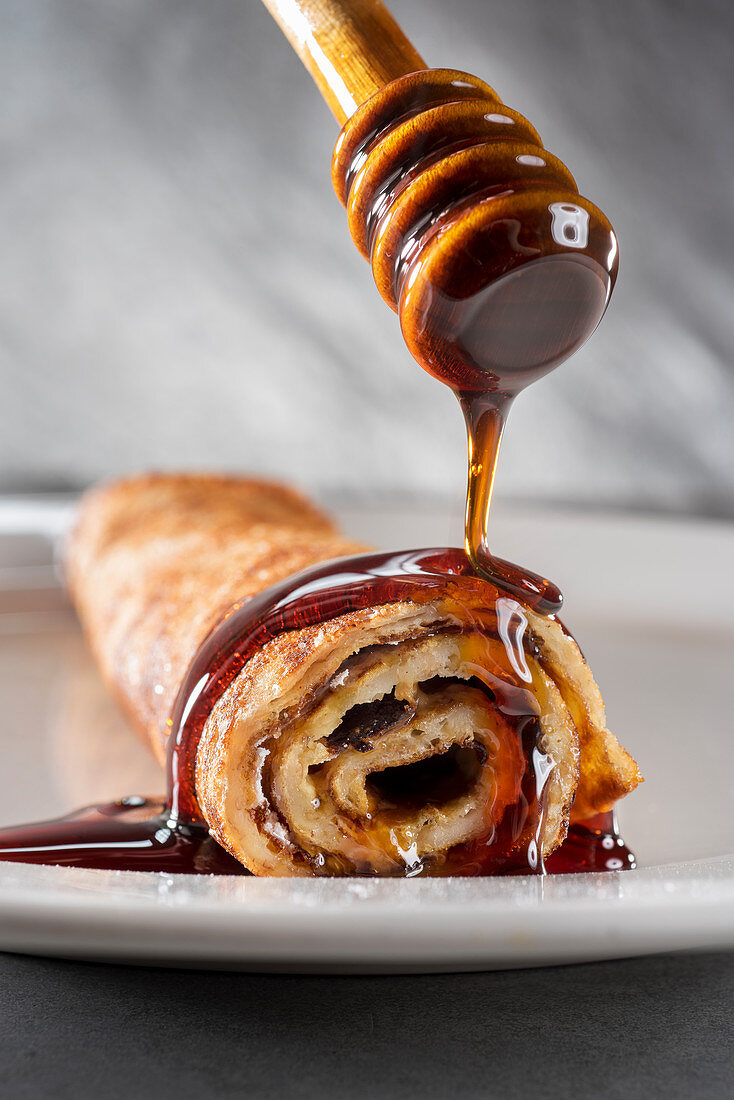 Pancake rolled with sirop