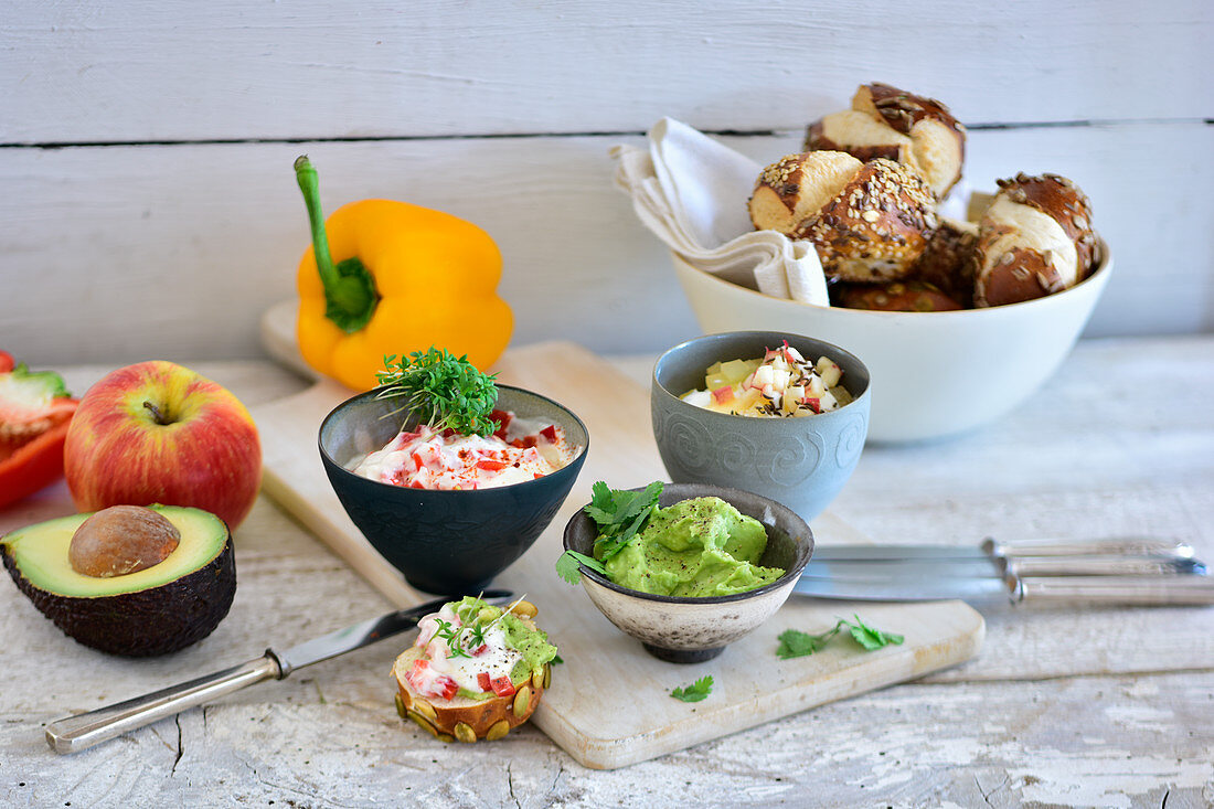 Various spreads with lye bread rolls