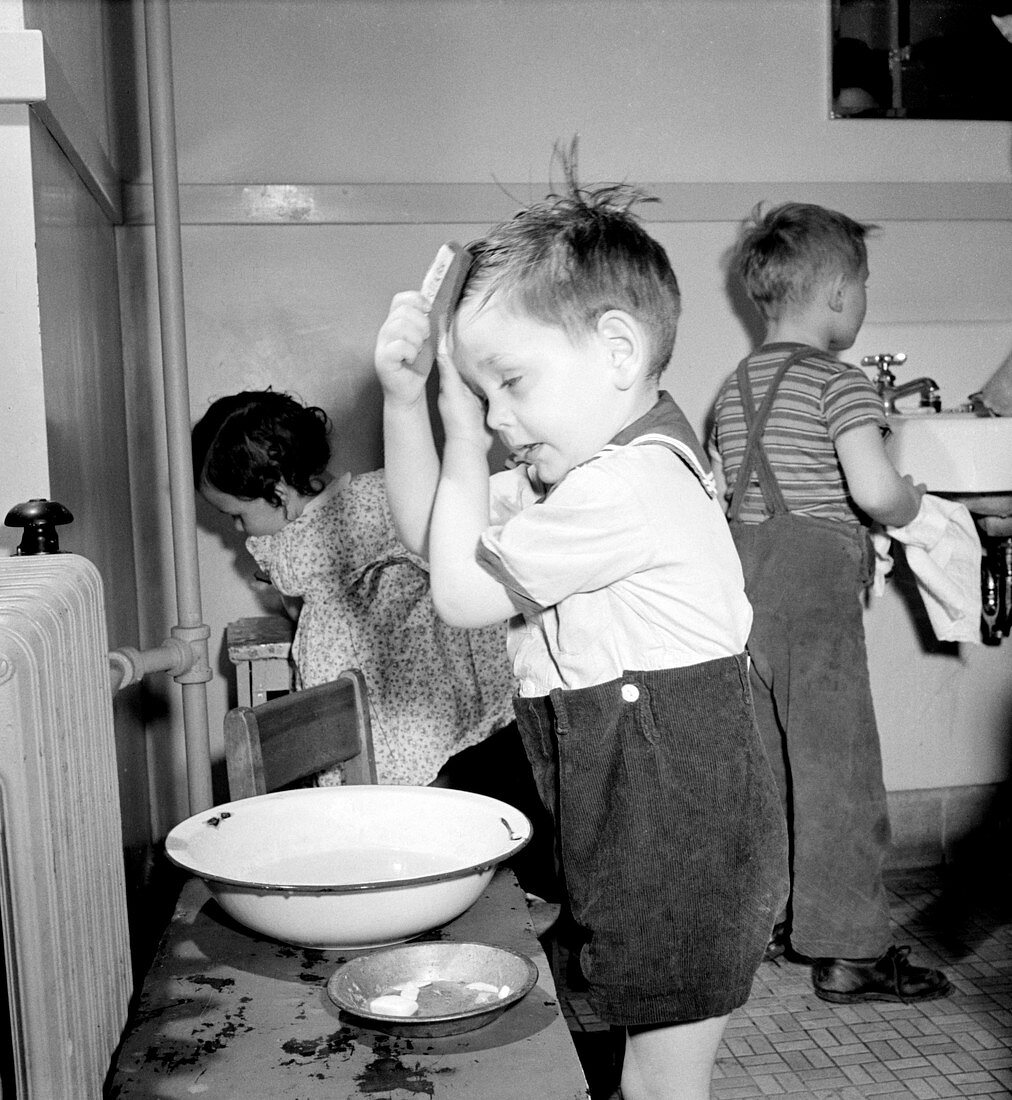 Pre-School Child Combing Own Hair, 1943