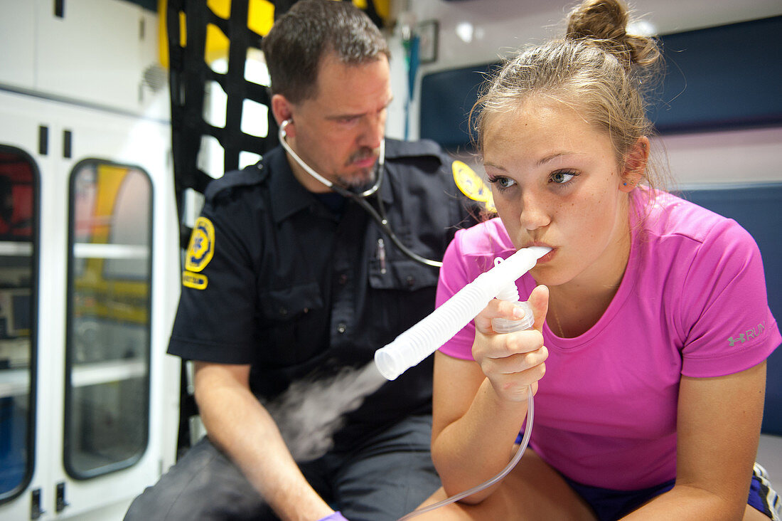 EMT Listening to Asthmatic Patient's Chest