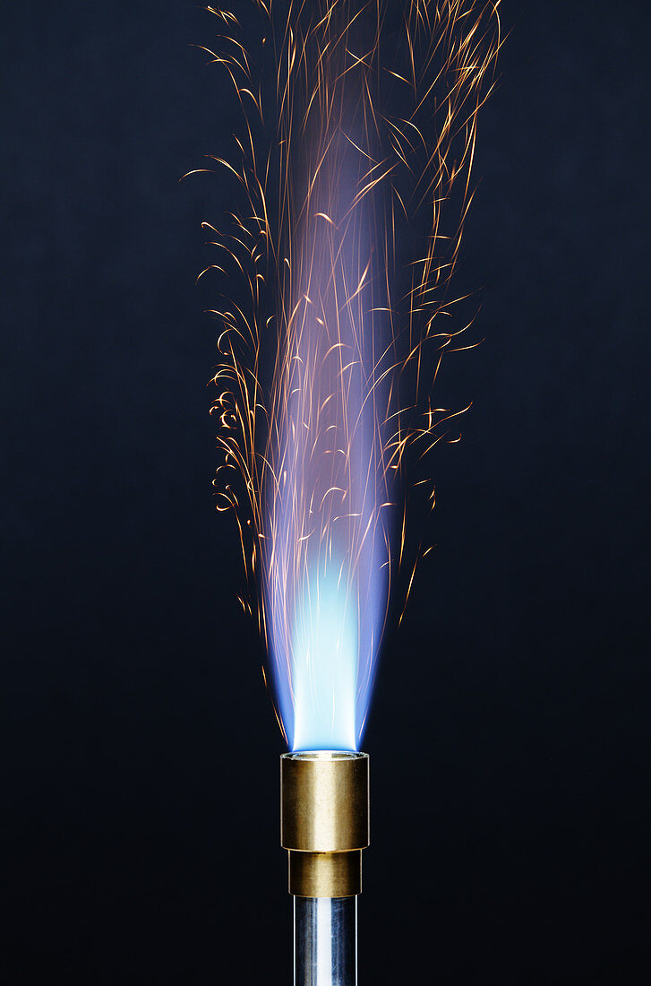 Iron sparkles over flame