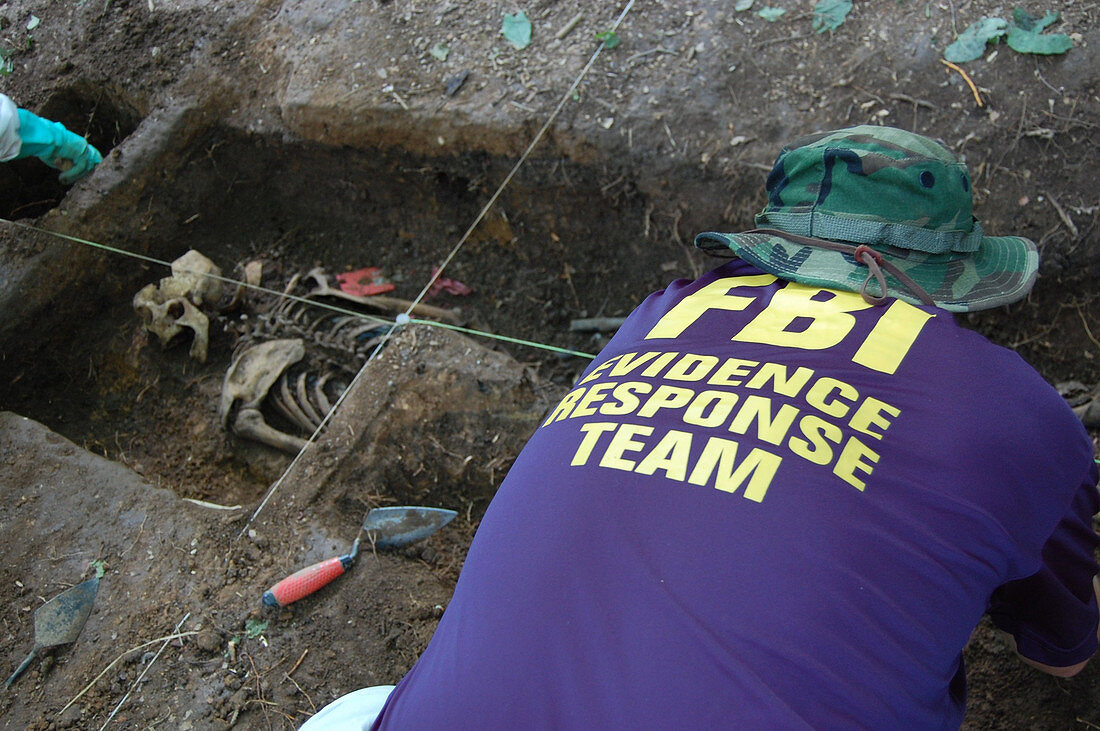 FBI ERT Agent Excavating Human Remains, 2009