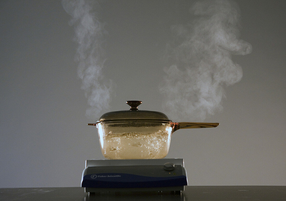 Water Boiling in Amber Glass Pot