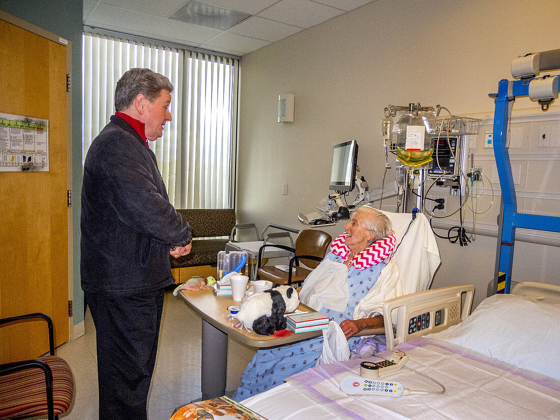 Priest Visits Hospital Patient