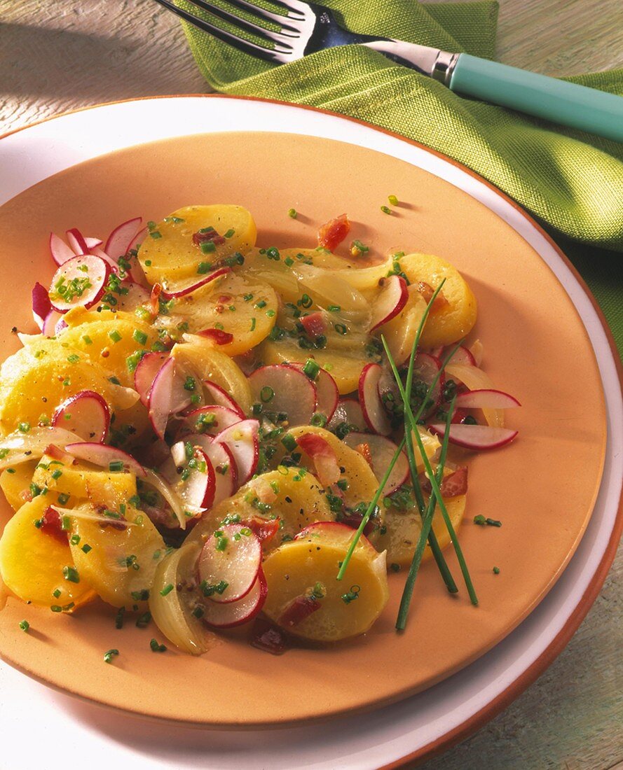 Potato salad with radishes, onions and chives