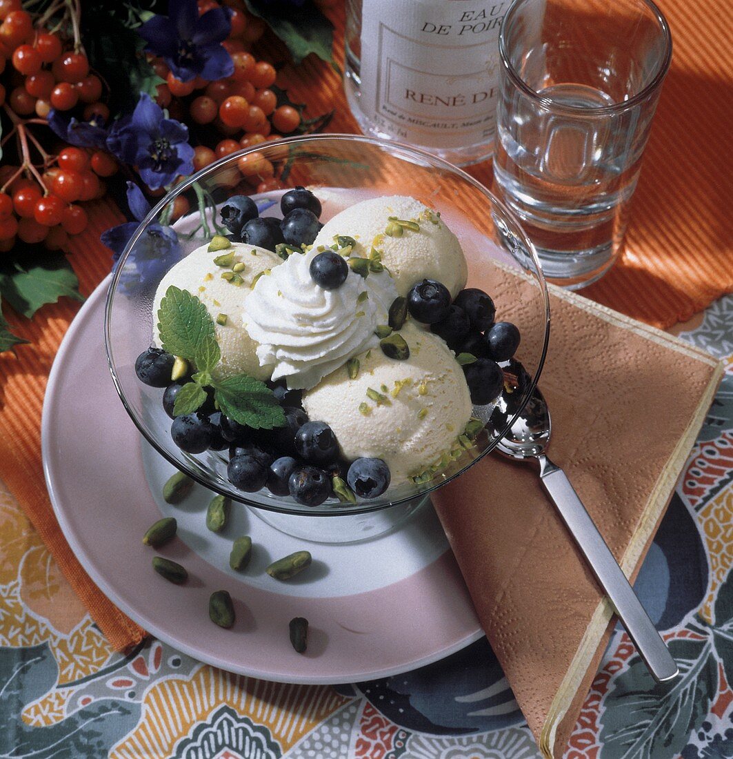 Vanilla Ice Cream with Fresh Blueberries and Pistachios; Whipped Cream
