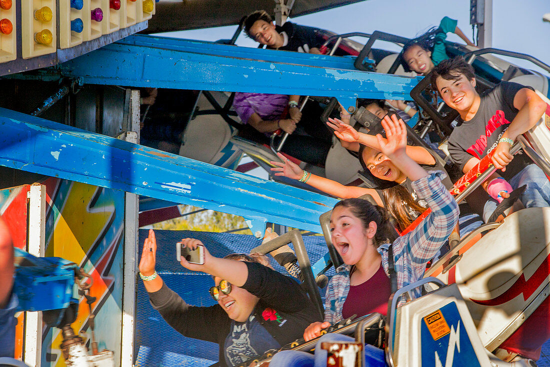 Children on amusement park ride