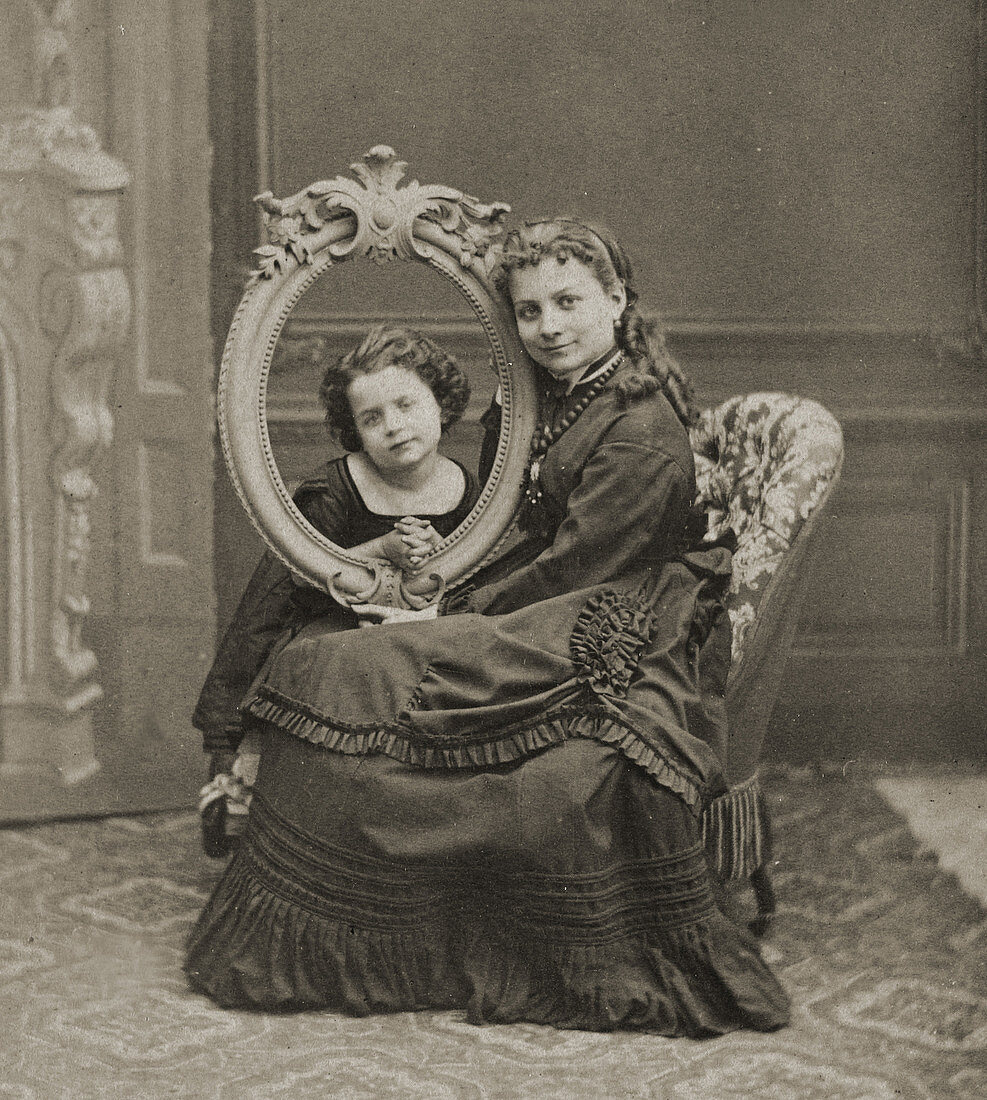 Young Woman Posing with Framed Child, 1870