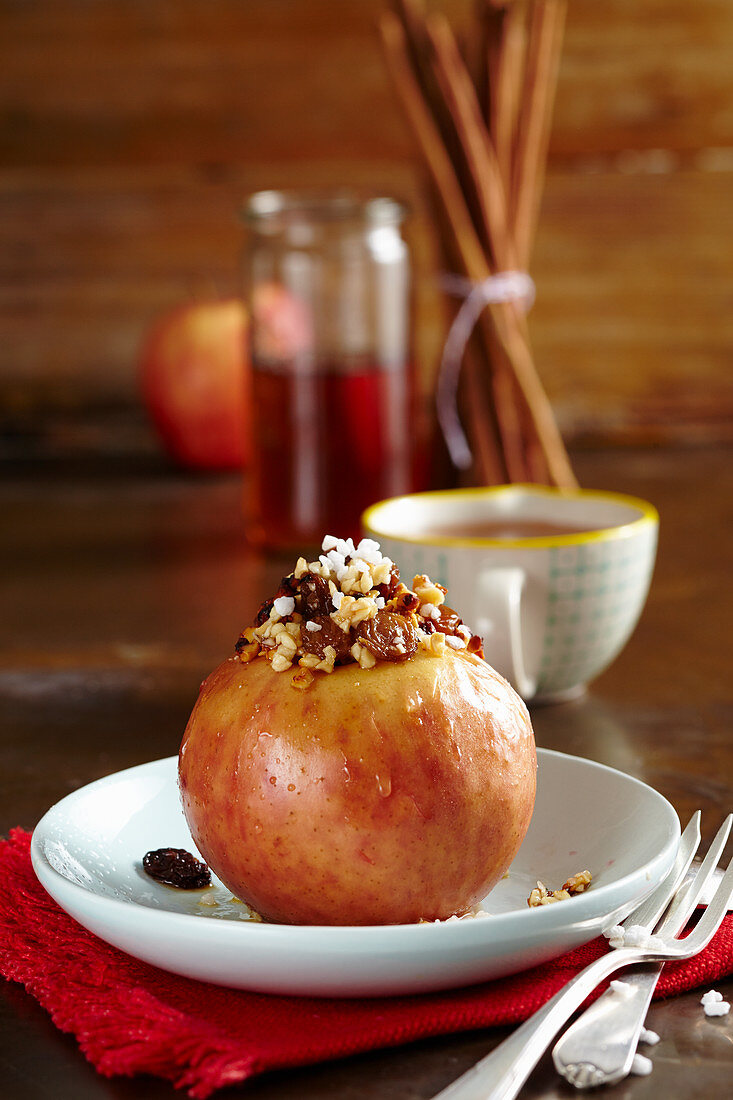 A baked apple with almonds, sultanas and syrup (Christmas)