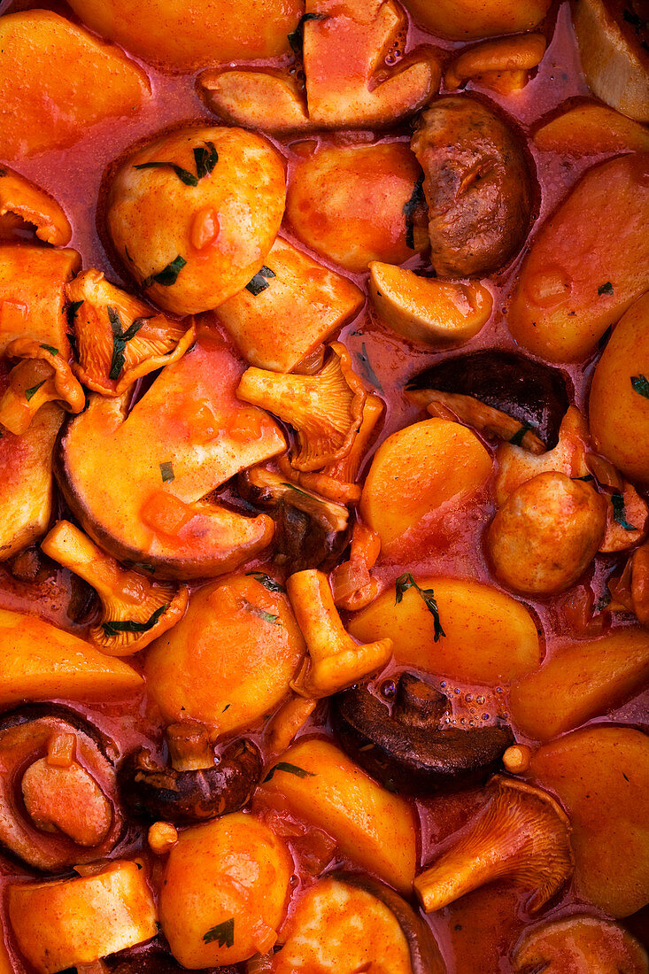 Autumnal pumpkin and sausage goulash with mushrooms