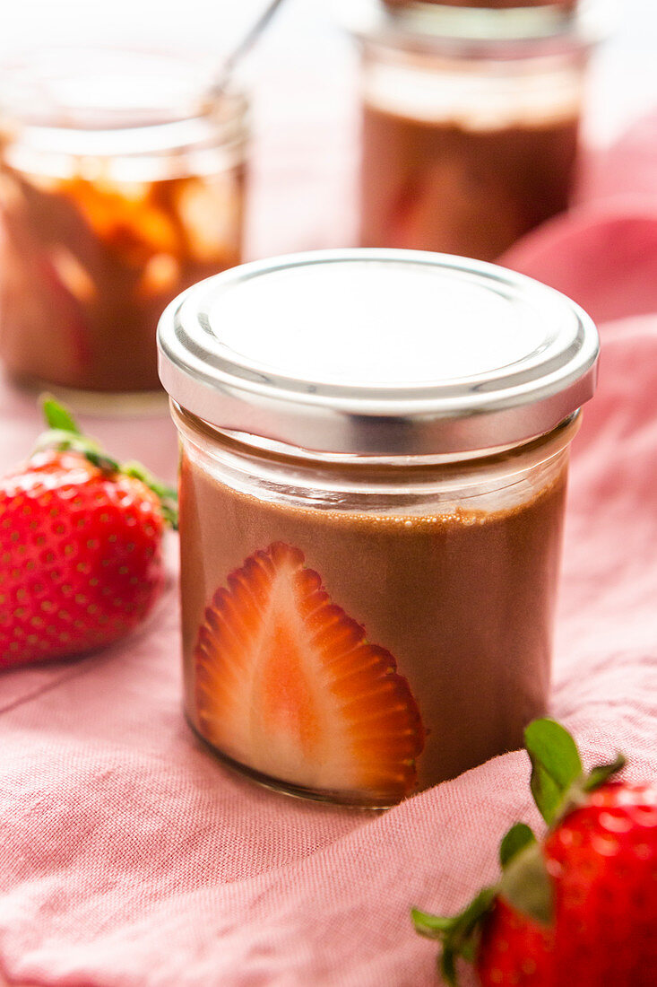 Chocolate mousse with strawberries in a jar