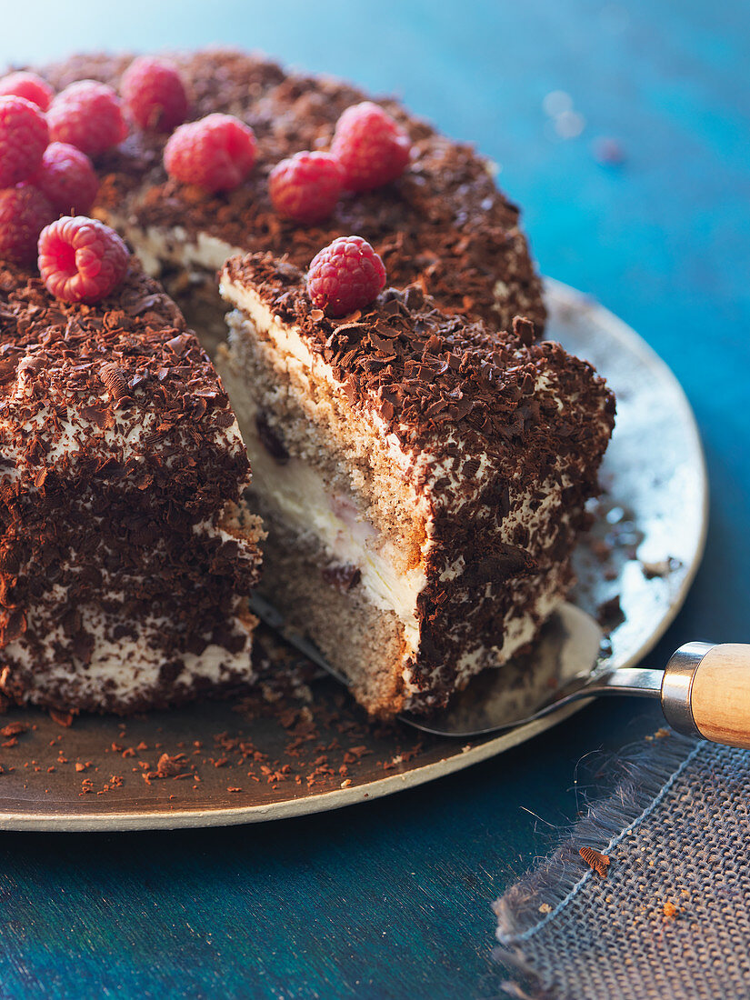 Buckwheat cake with grated chocolate and raspberries