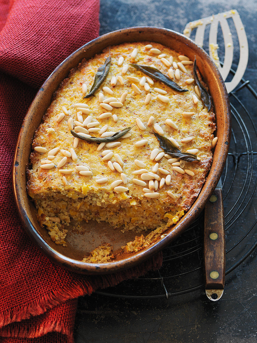 Millet semolina and pumpkin bake with pine nuts and sage