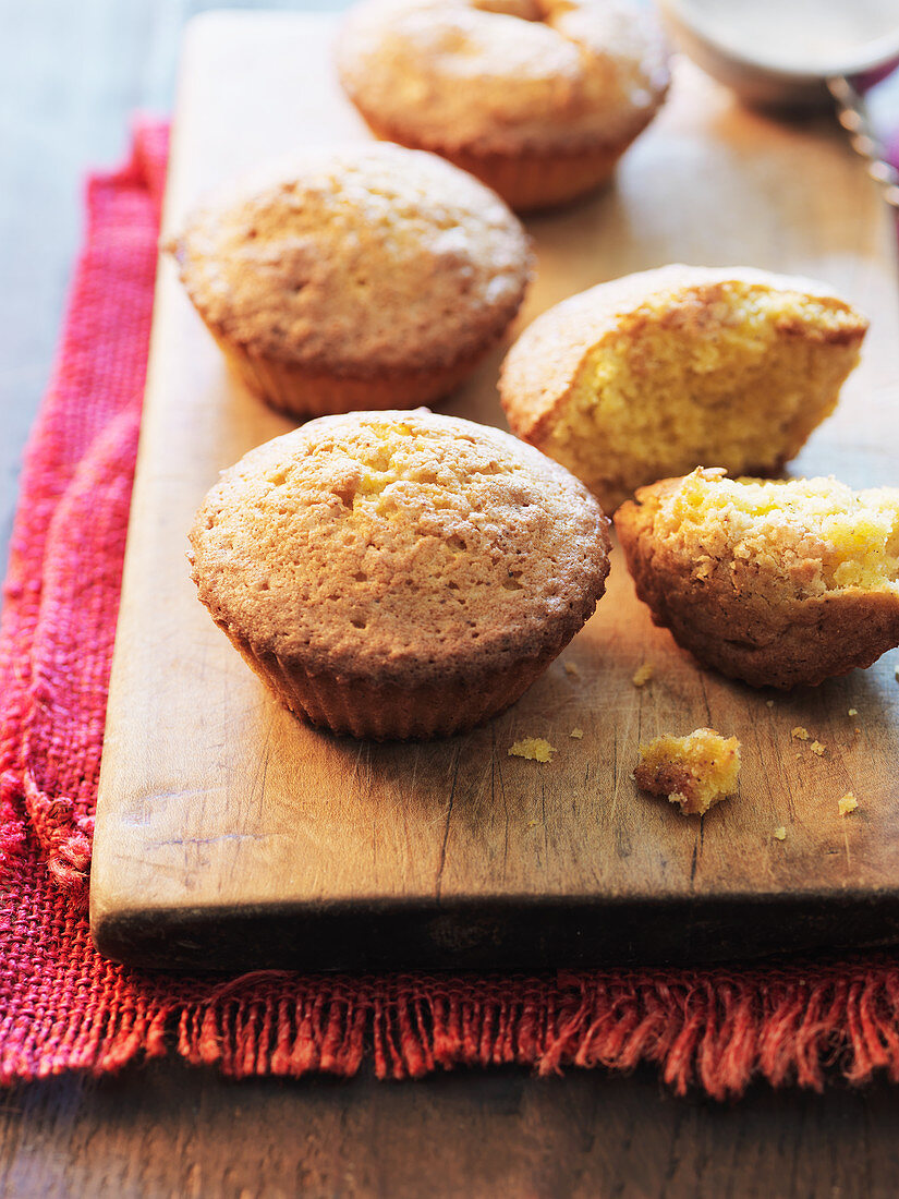 Corn muffins on a wooden chopping board