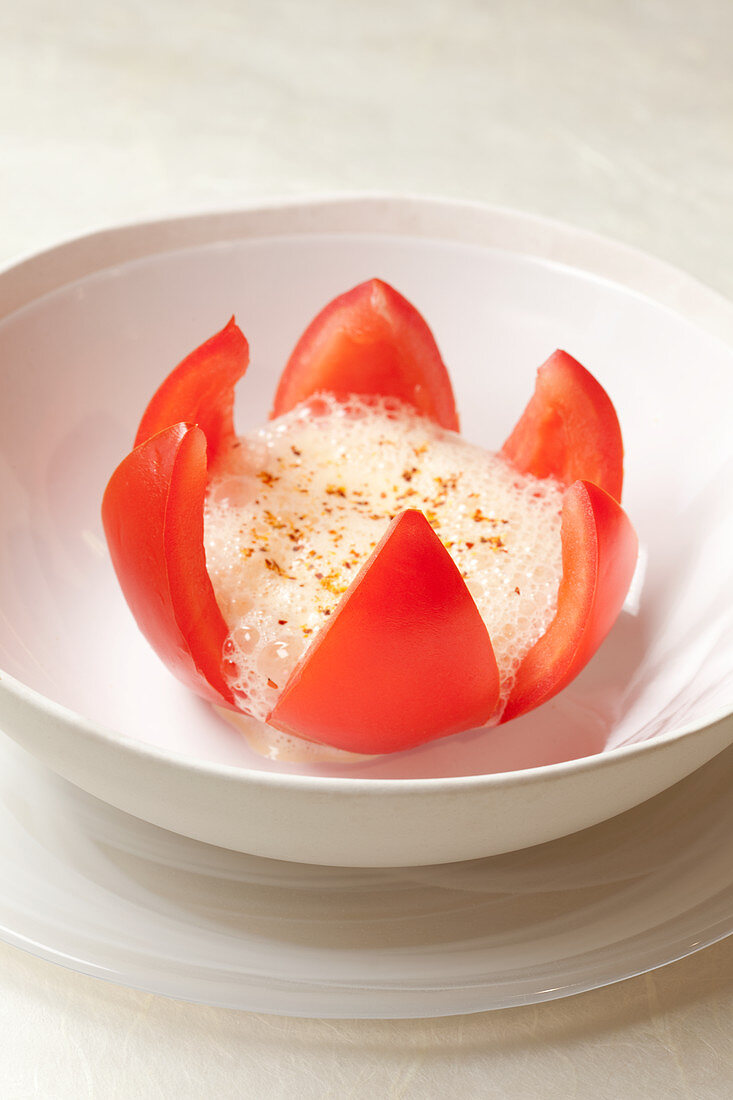 A tomato flower with an olive oil emulsion