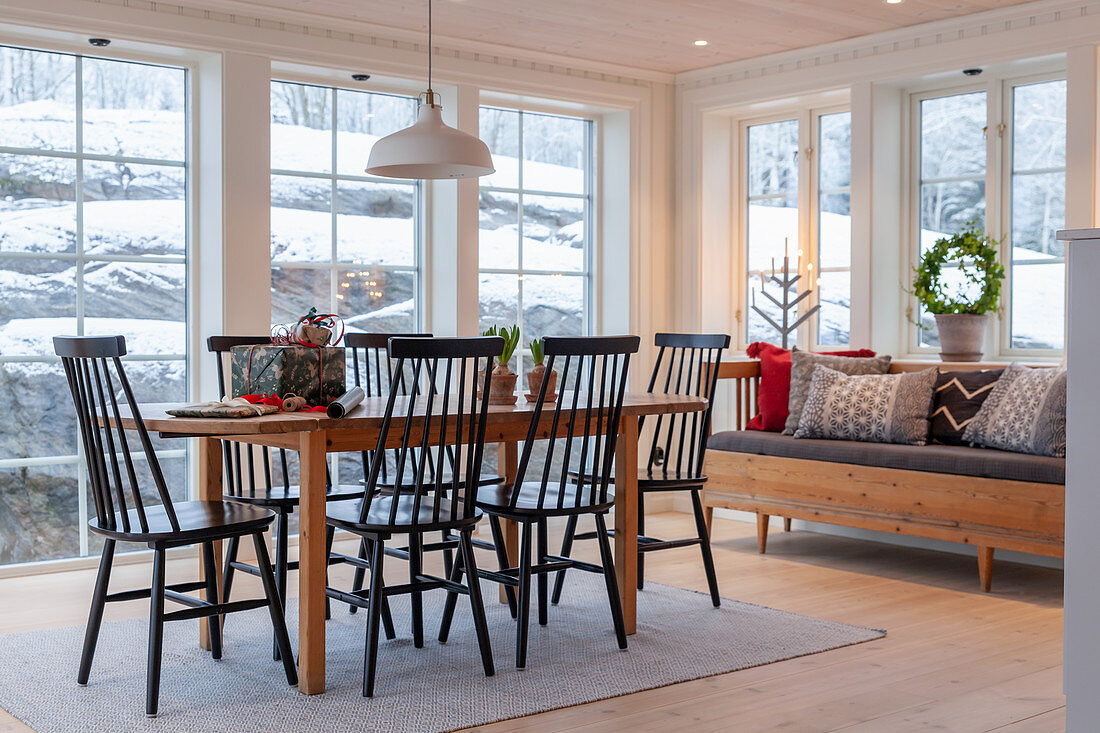 Dining table, chairs and sofa in conservatory