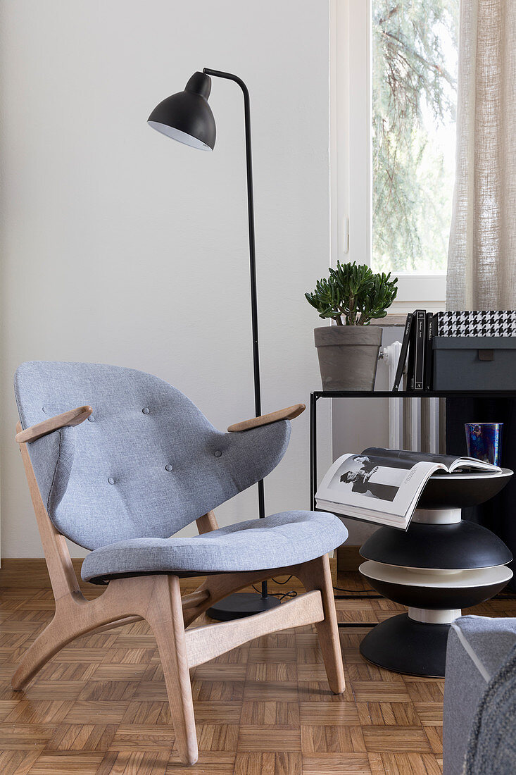 Scandinavian-style armchair and designer side table