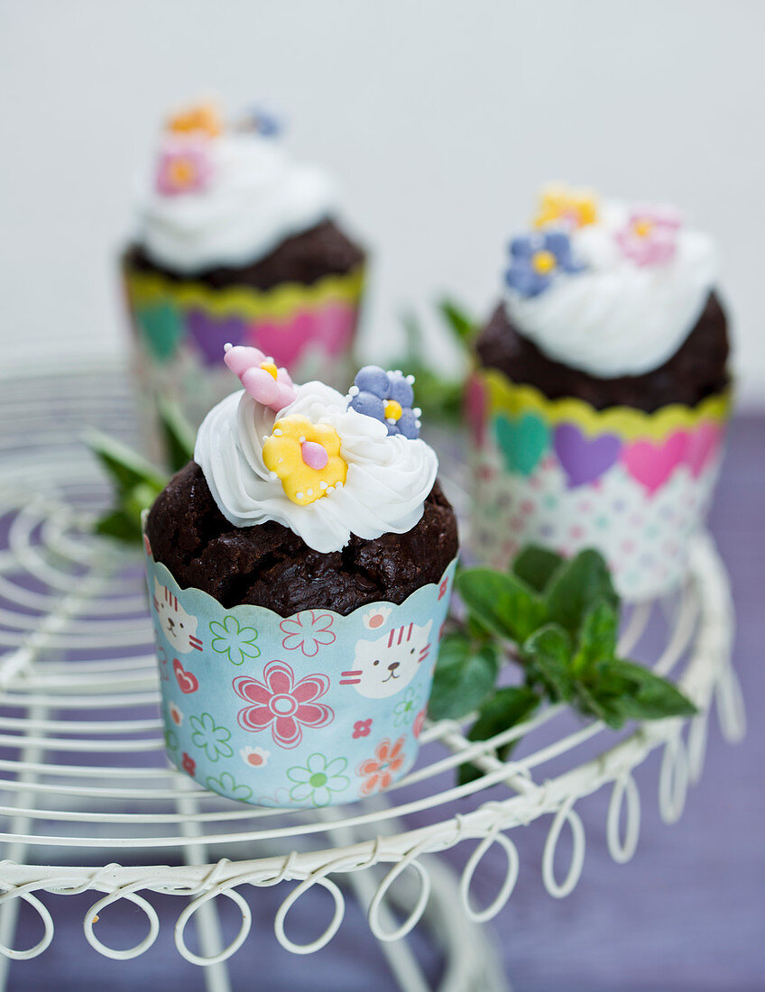 Chocolate cupcakes with flowers decoration