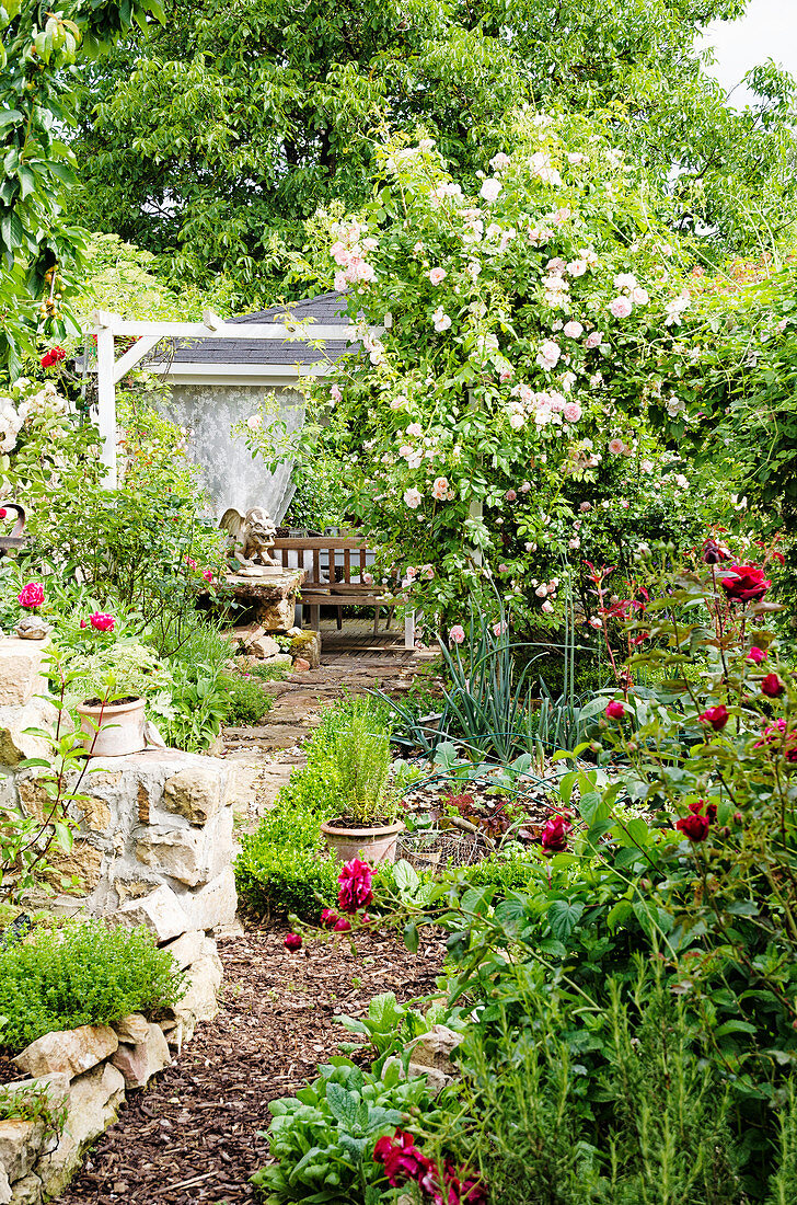 Pavilion in the rose garden, path with bark mulch