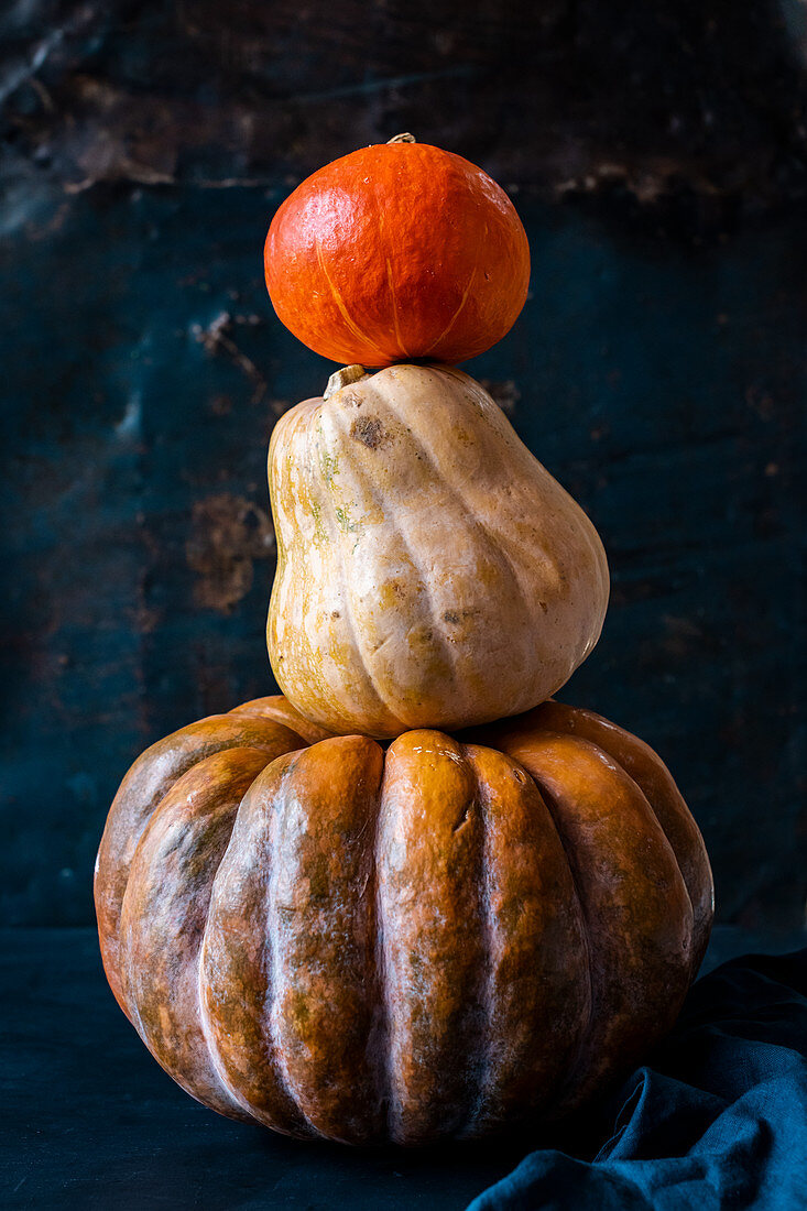 A stack of three pumpkins