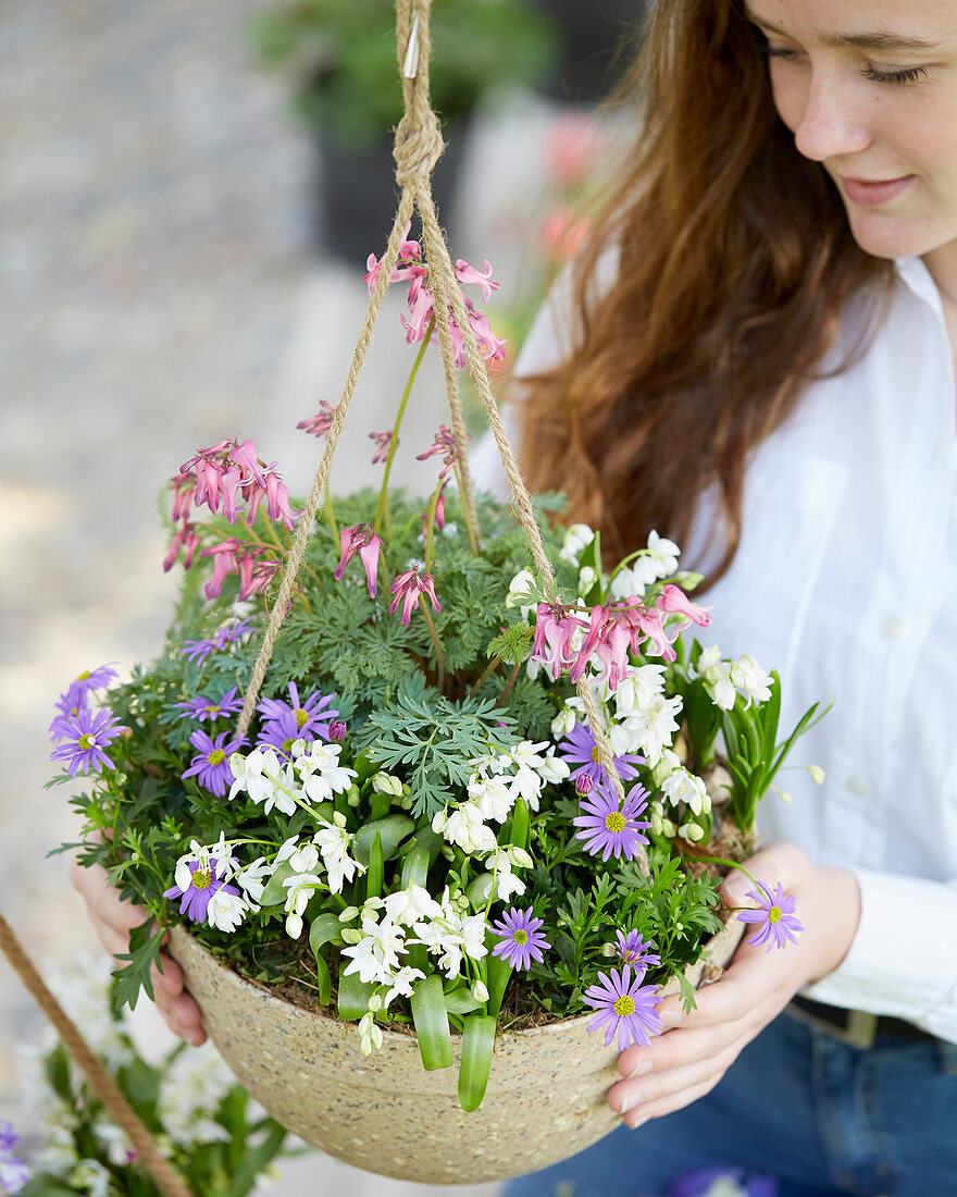 Young lady with hanging basket